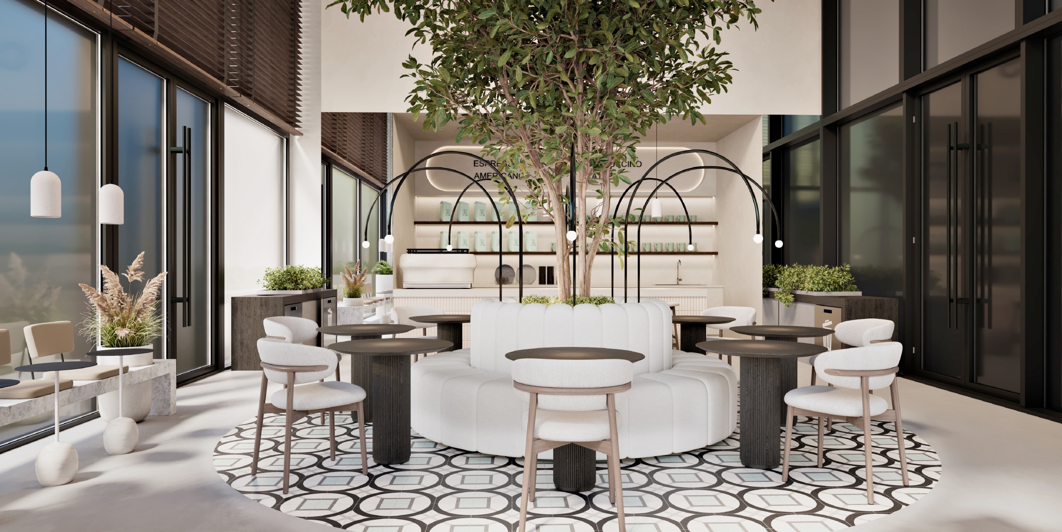Central round sofa and cafe tables arranged around a tree beneath arched lights