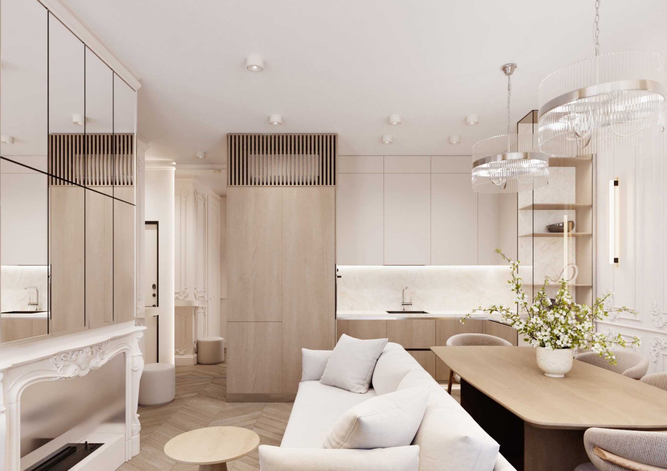 Open living room with kitchen joinery, dining table, sofa and chandelier light