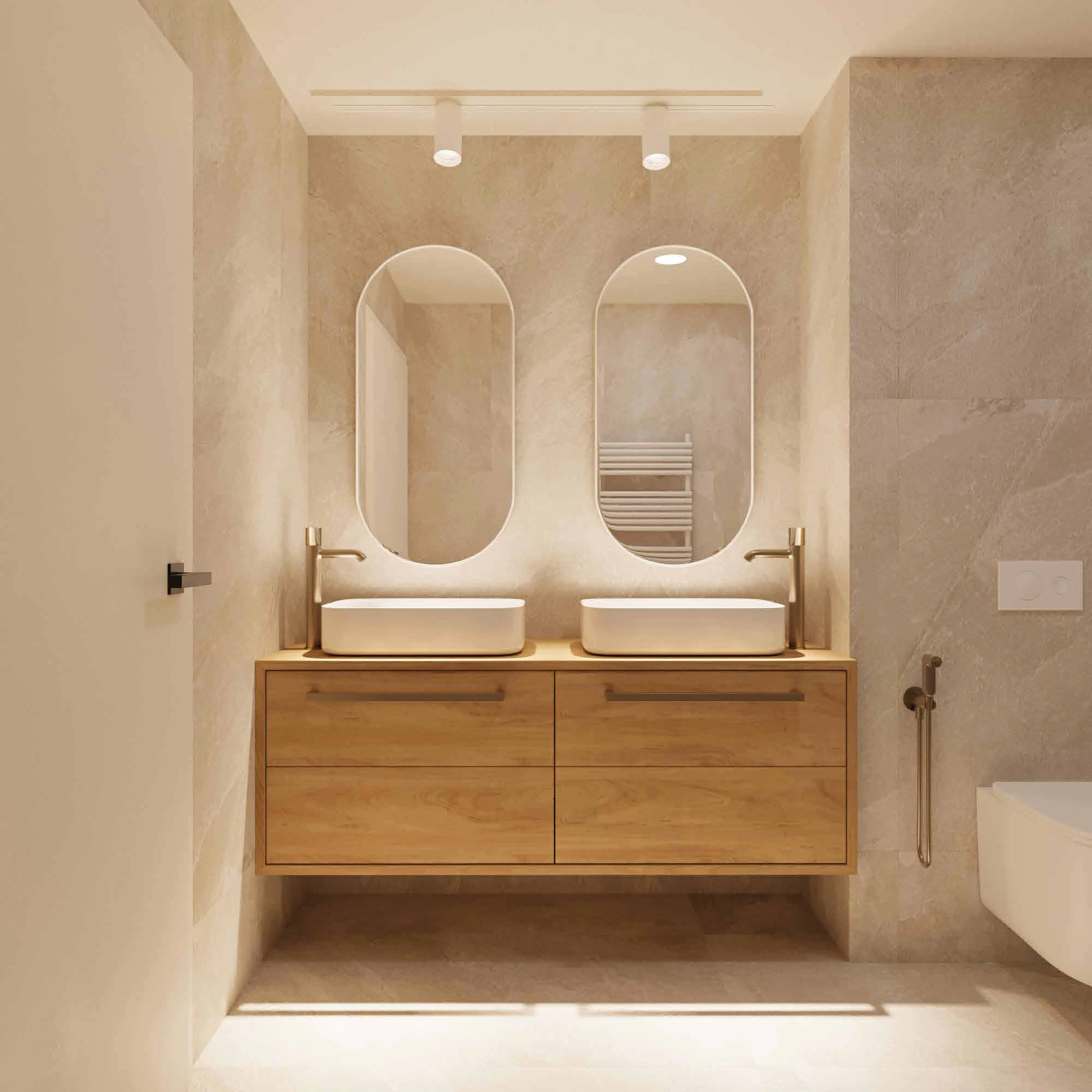 The bathroom's oak vanity, twin basins and rounded mirrors