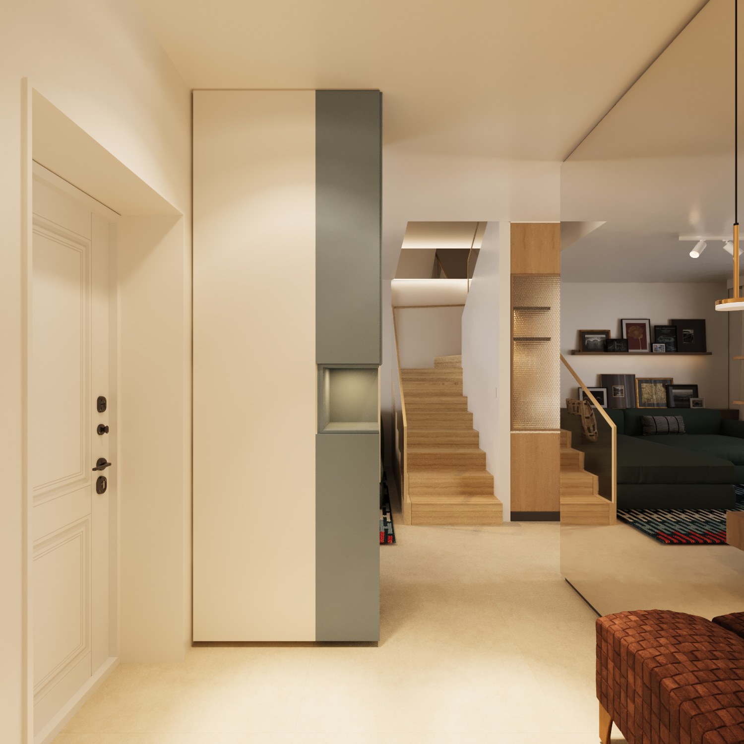 Entrance transition toward the stair and living area with tall storage and warm lighting